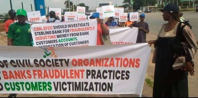 CSOs protest at CBN HQs, accuse Sterling Bank of fraud, exploiting customers