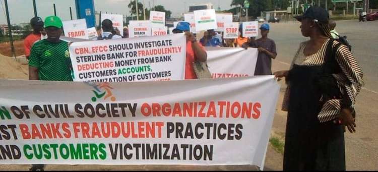 CSOs protest at CBN HQs, accuse Sterling Bank of fraud, exploiting customers