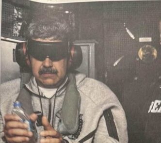 Trump releases photo of Maduro boarding US aircraft after airstrikes